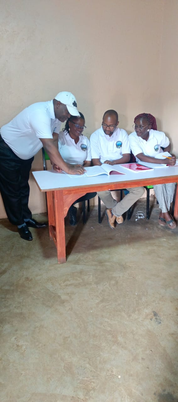 OOTI staff reviewing training records together