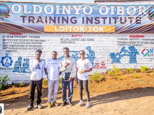 Trainees standing at the entrance of Oldoinyo Oibor Training Institute